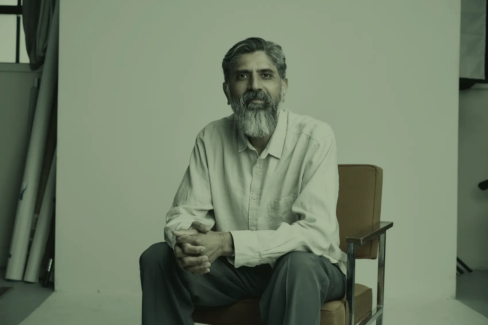 Dr. Yasin Choudry, seated, calm and at ease.